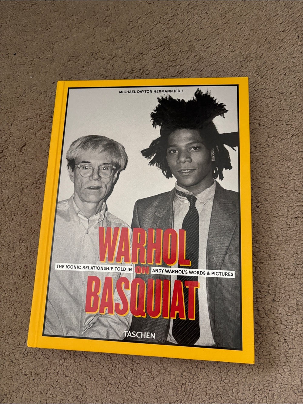 Taschen hardcover — Yellow spine with Pink title text